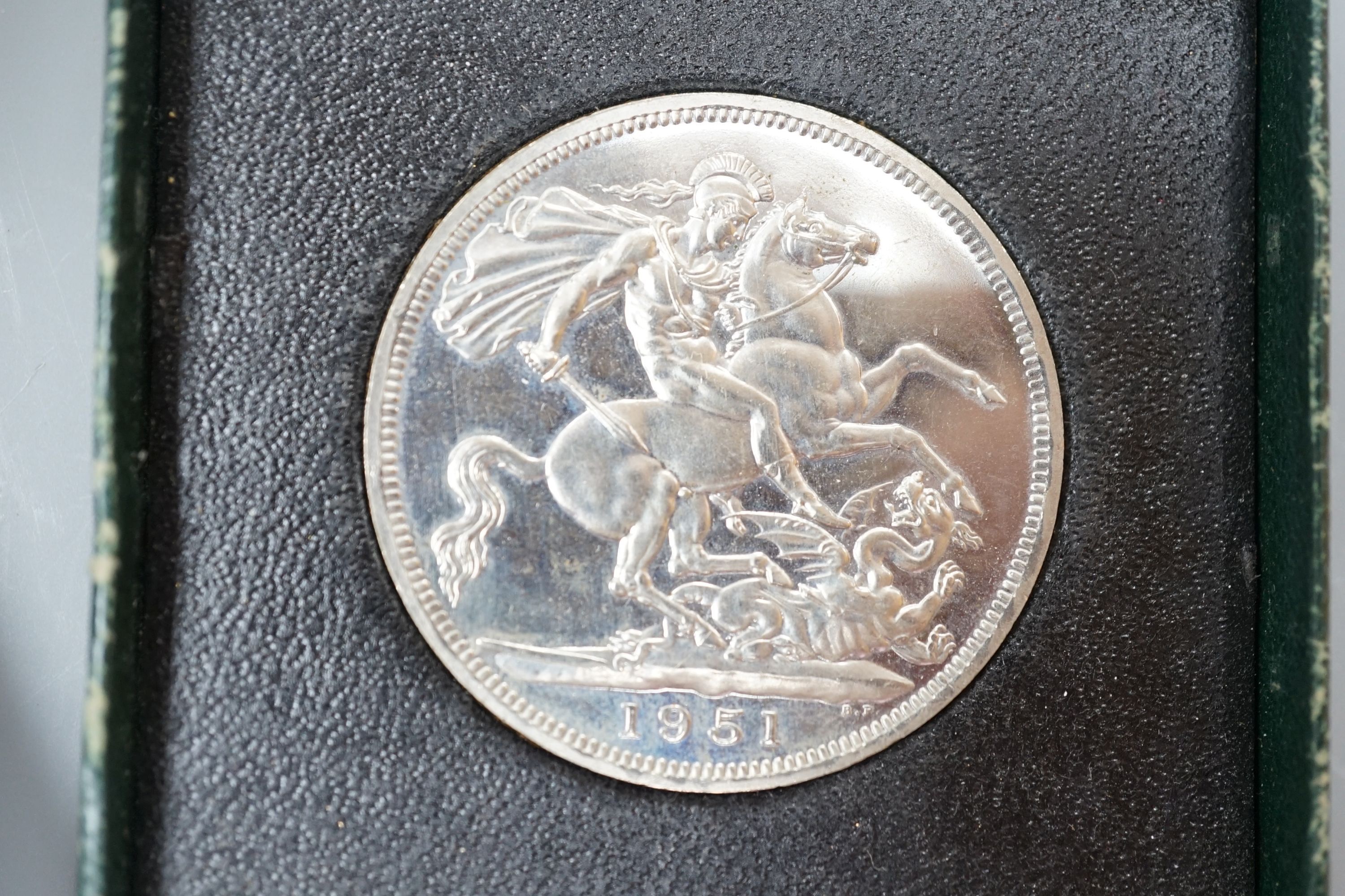 A white metal bracelet and minor jewellery and coins.